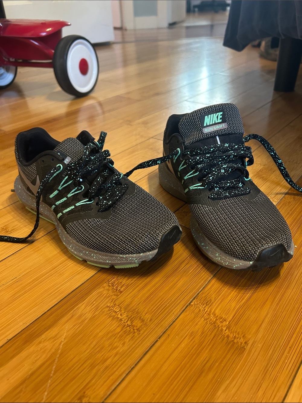 Nike Women’s Black Sneakers with Teal Accents